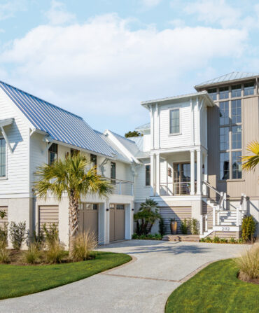 A white house with palm trees