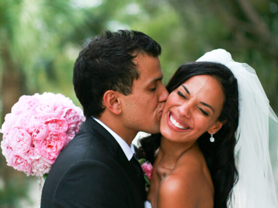 A bride and groom embrace