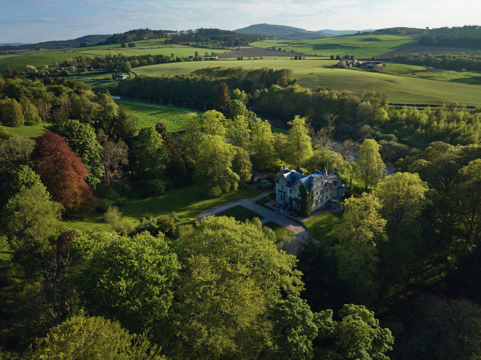 A stone estate in the middle of rolling hills