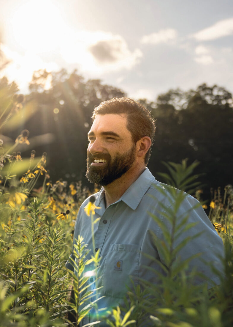 A man stands in a prairie