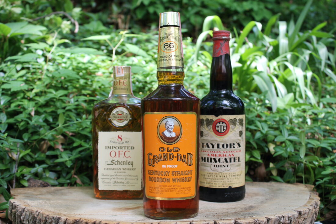 Bottles of bourbon on display a stump