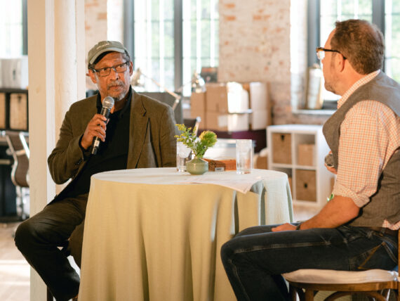 Two men on a speaking podium