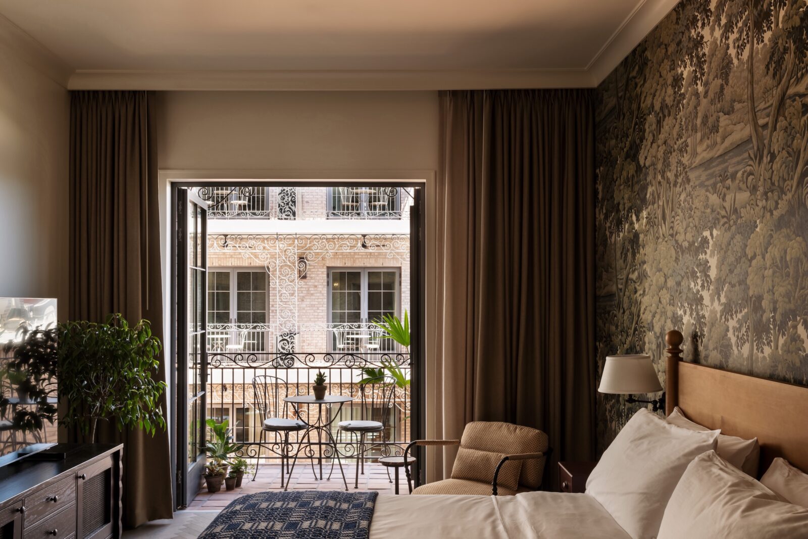 A guest room with a balcony